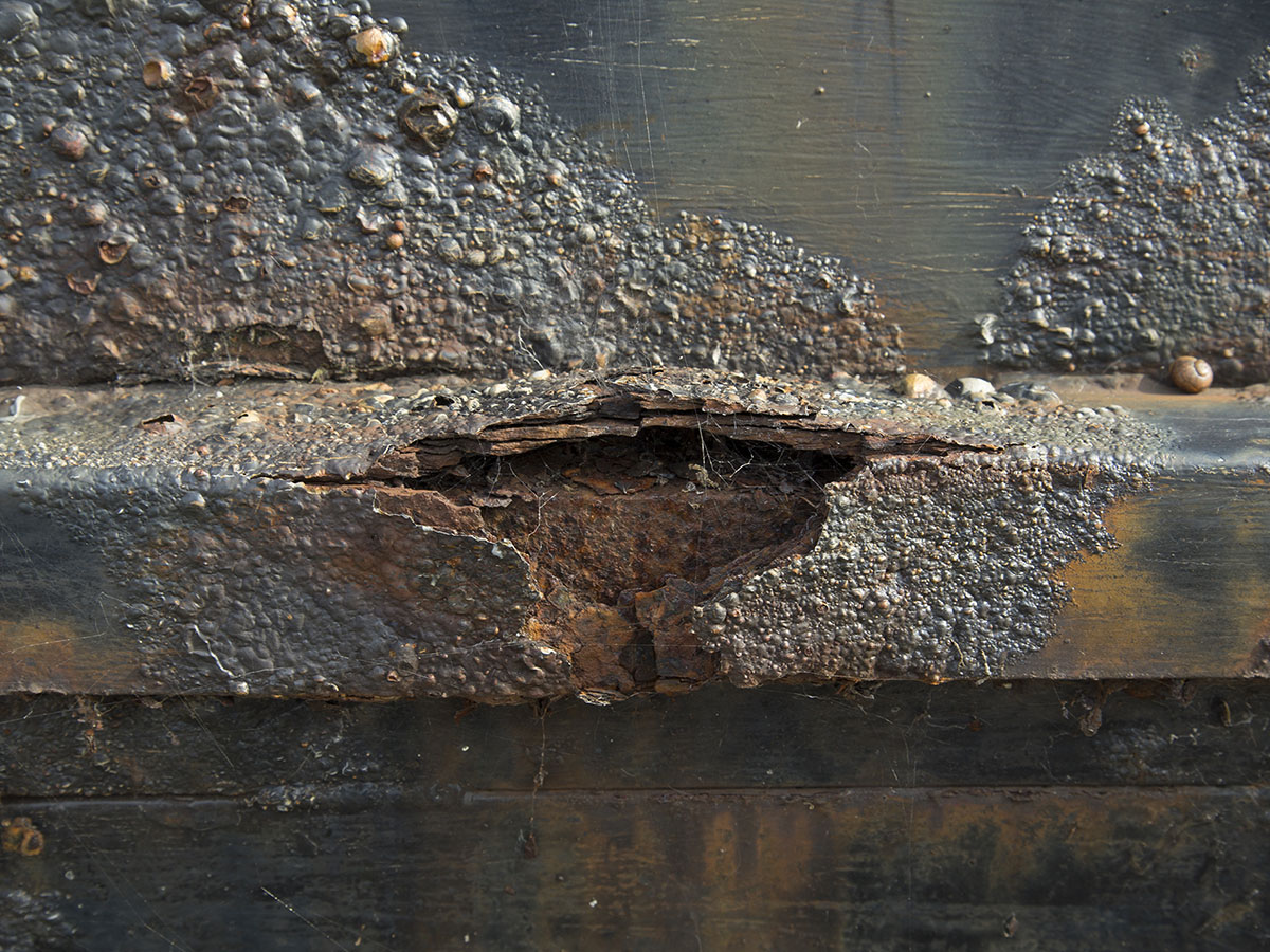 Rusty basement wall due to water intrusion.